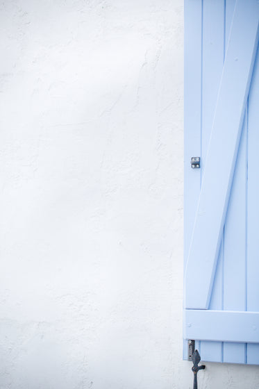 a plain blue wooden door