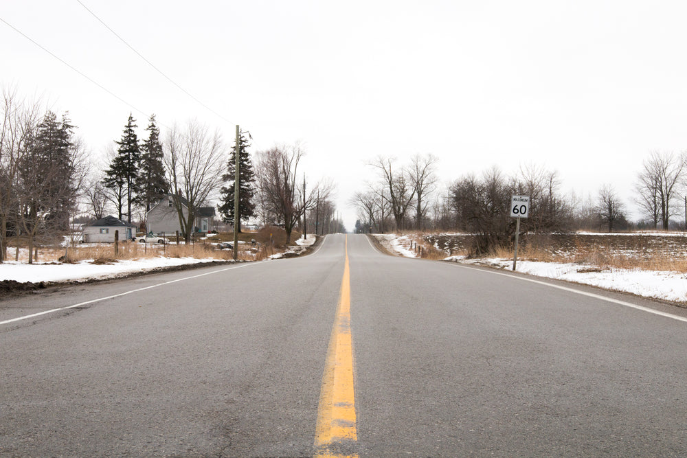 a quiet road in the last moments of winter