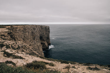 a rocky plateau curves around a little bay