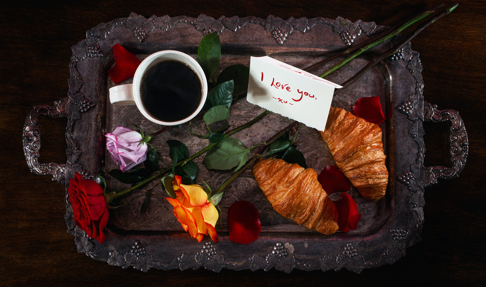 a romantic tray of roses and breakfast