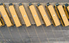 a row of parked yellow school buses