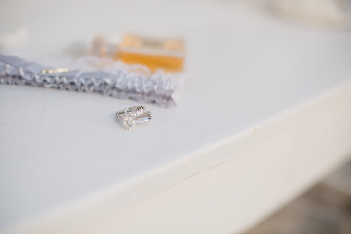 a set of wedding rings set on white table
