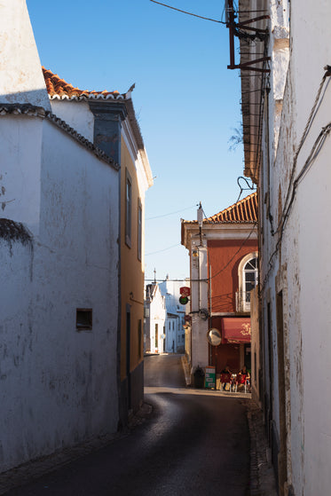 a shadowy street sheltered from sunlight