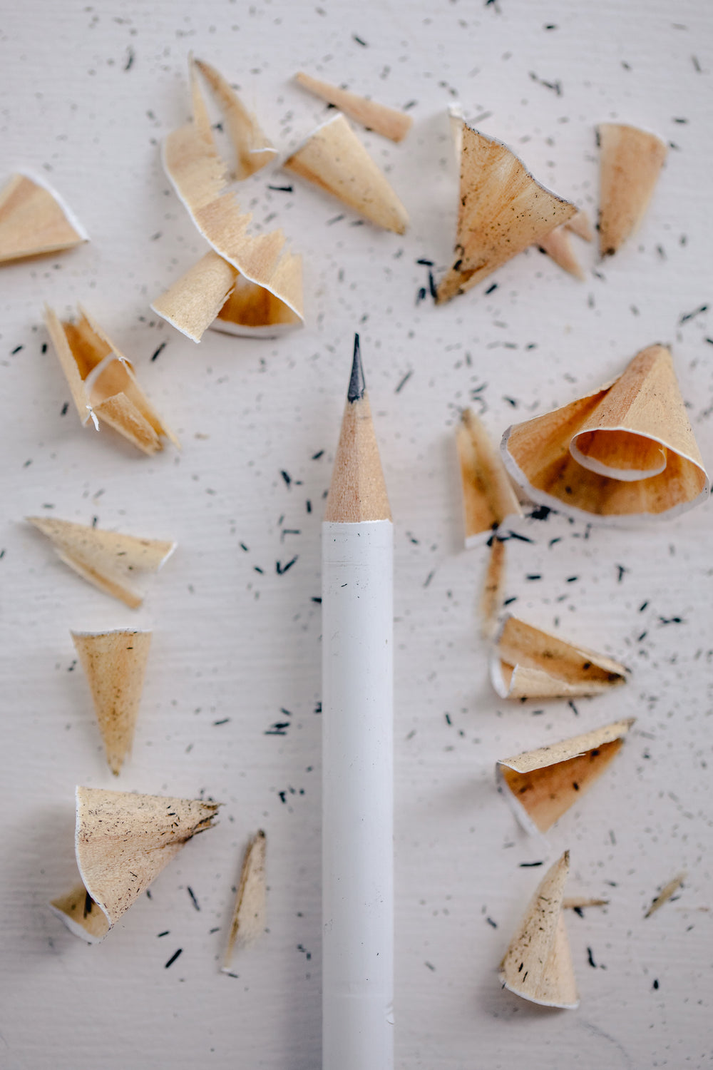 a sharpened pencil with lead shavings