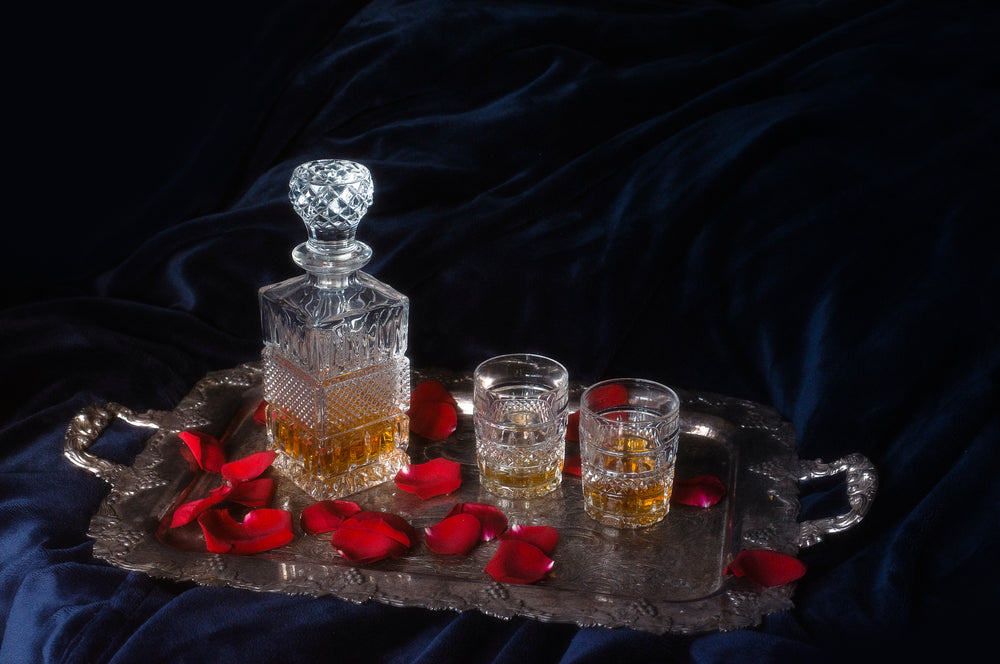 a silver tray sits on a blue velvet background