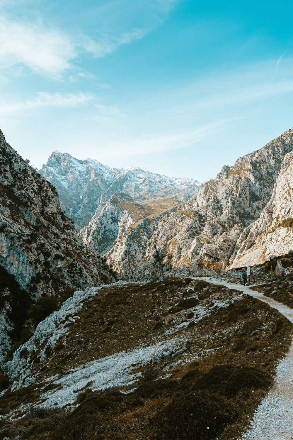 a single hiker taking on the mountainous terrain