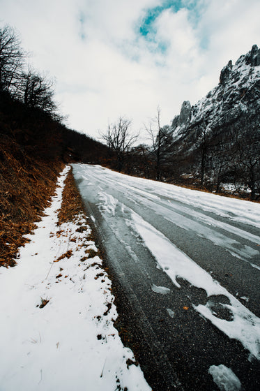 a slush covered lonely winter road