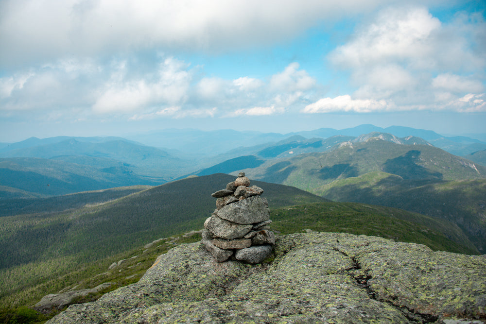 a small pebble pile on top a mountain