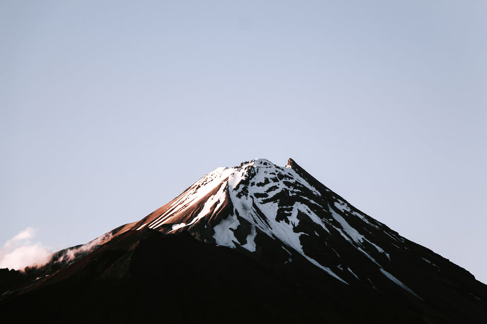 a snow capped mountain summit