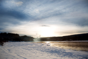 a snowy river bed and icy river