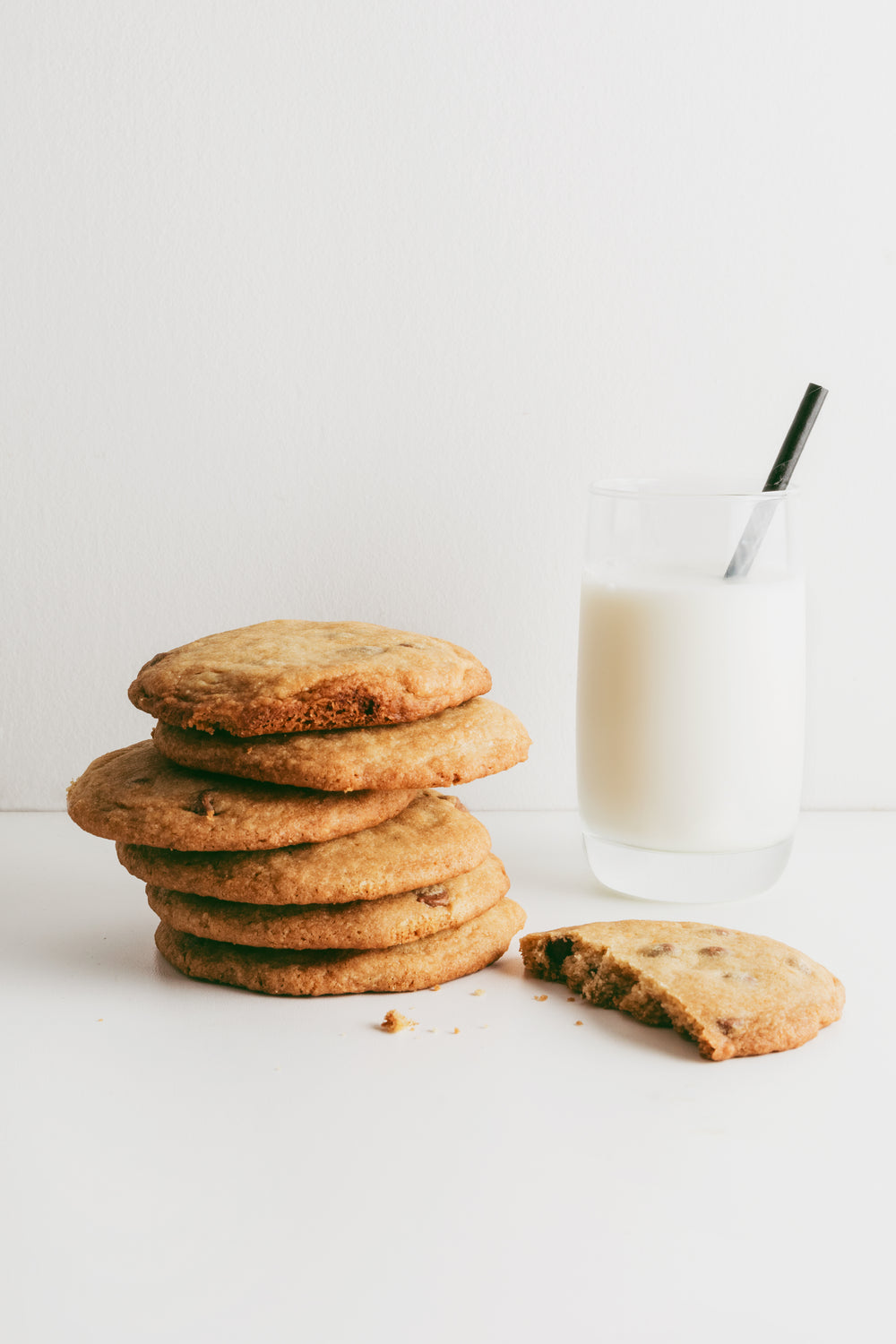 a stack of cookies and a glass of milk