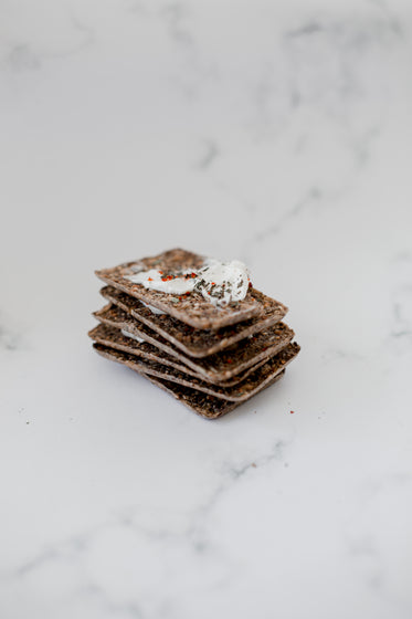 a stack of crackers on a marble counter top