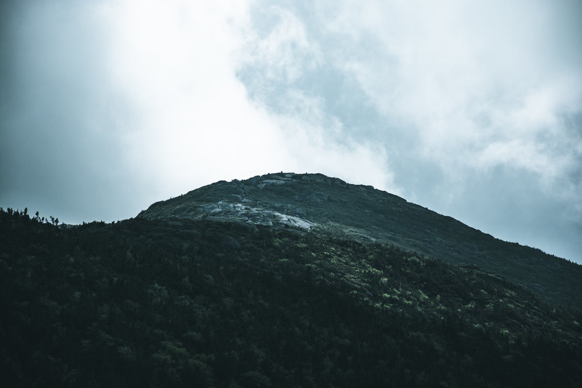 a stony hill under a grey sky