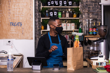 a store employee packing up groceries