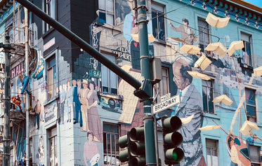 a street mural depicts musicians and others