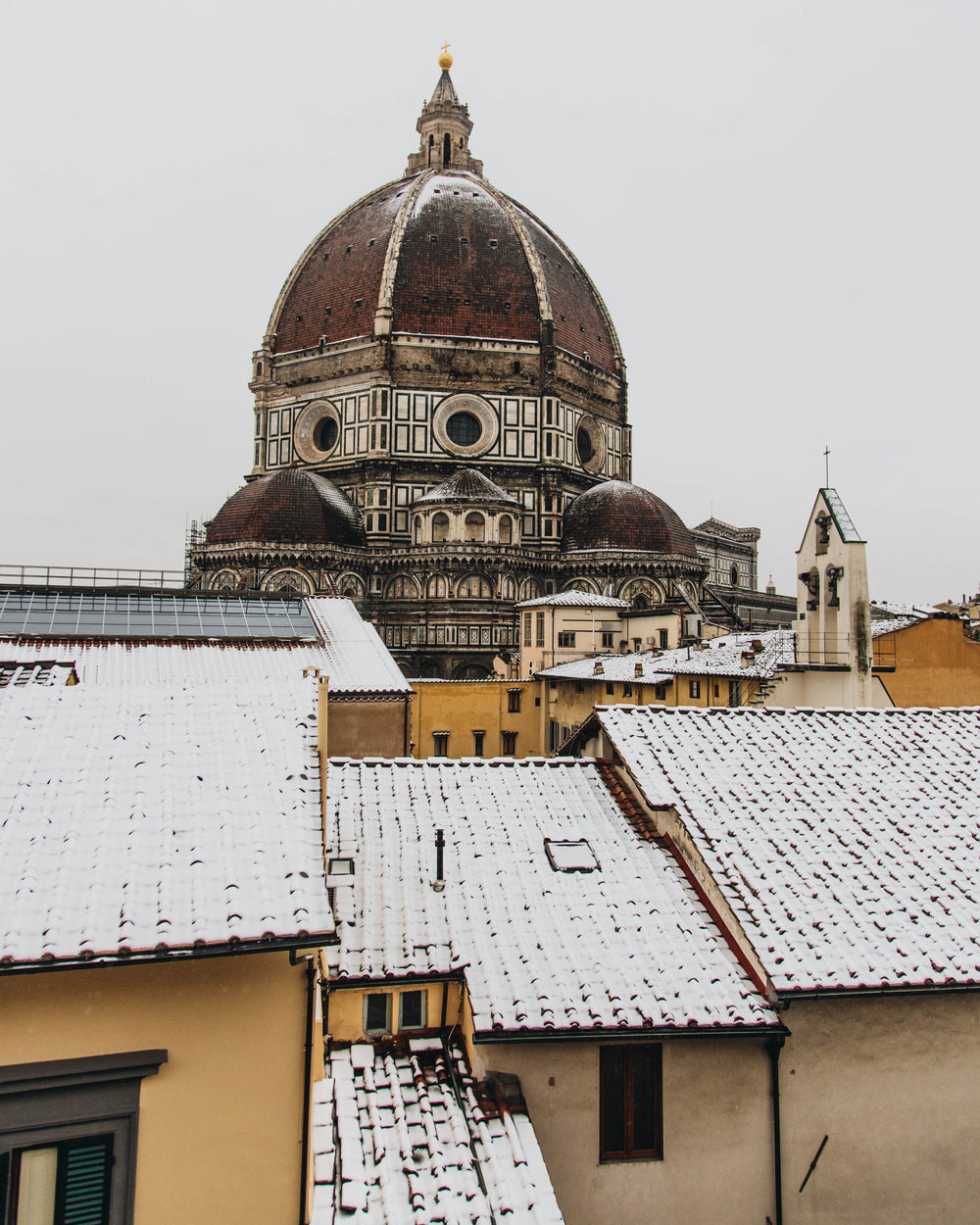 a tall cathedral in the snowy town