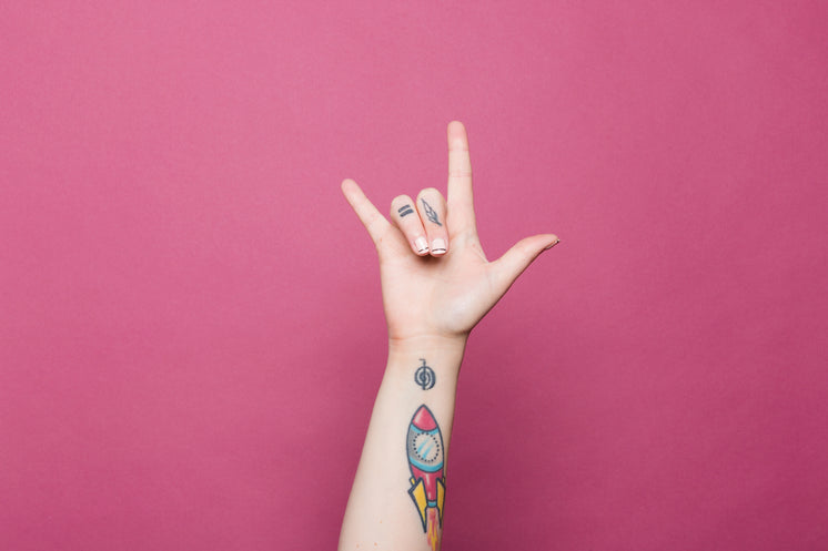 a-tattooed-hand-doing-the-sign-for-i-lov