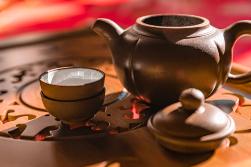 a tea set sitting on wooden table