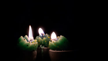 a trio of green candles