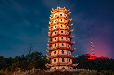 a unique structure lit up at twilight