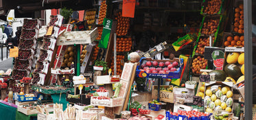 a van with overflowing boxes of fruit and vegetables