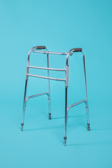 a walker in front of a blue background