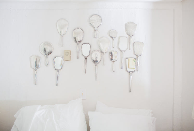 A Wall Of Hand Mirrors