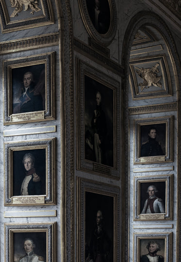 a wall of painted portraits