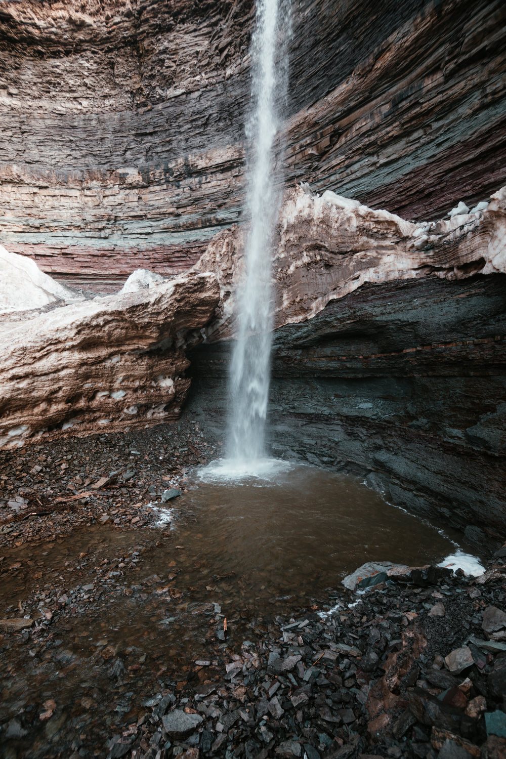 a waterfall in a rocky cavern