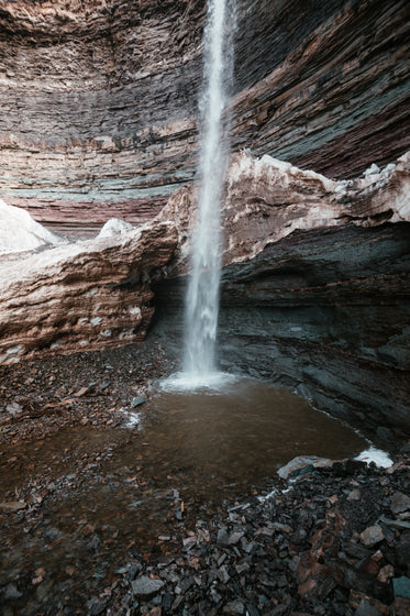 a waterfall in a rocky cavern
