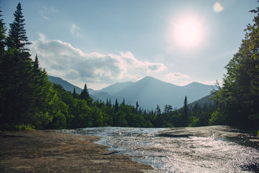 a watery patch on a stone plateau glimmers in the sunlight