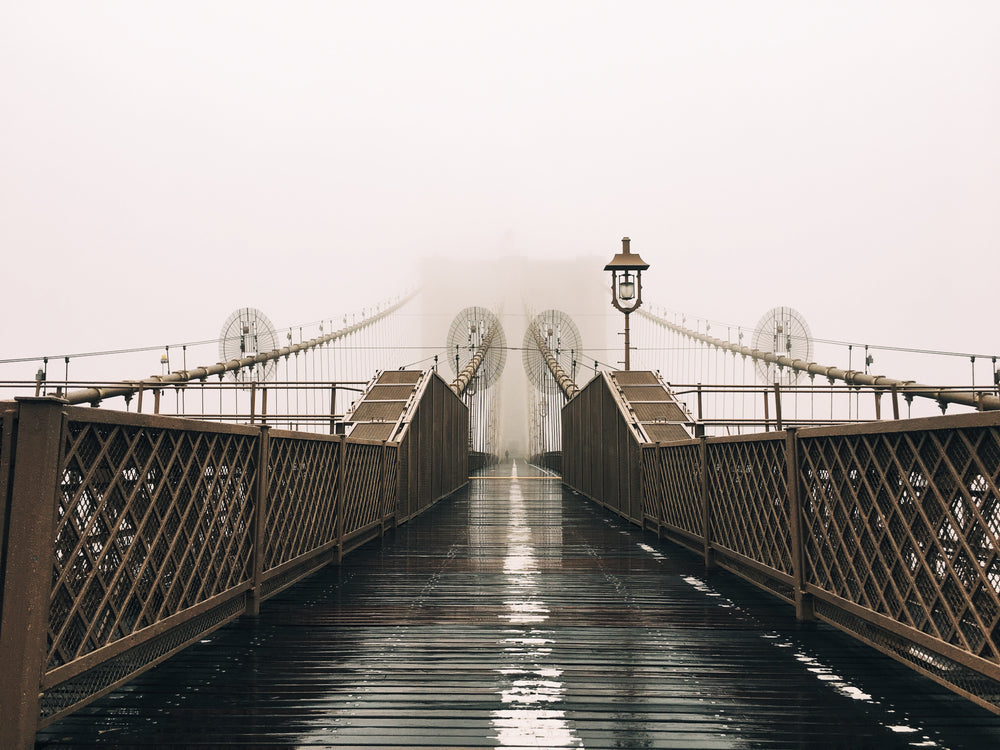 https://burst.shopifycdn.com/photos/a-wet-bridge-covered-in-fog.jpg?width=1000&format=pjpg&exif=0&iptc=0