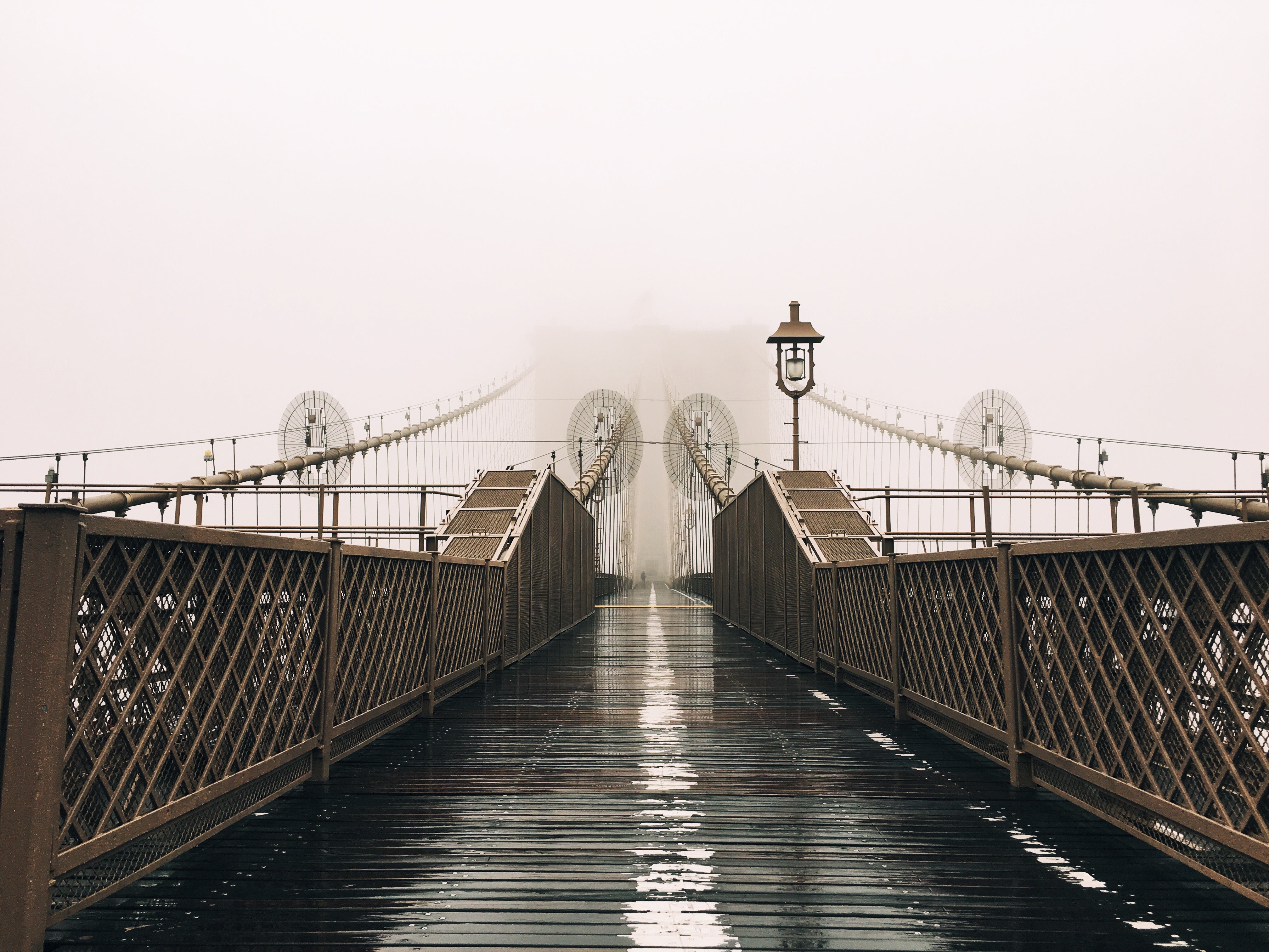 A Wet Bridge Covered In Fog