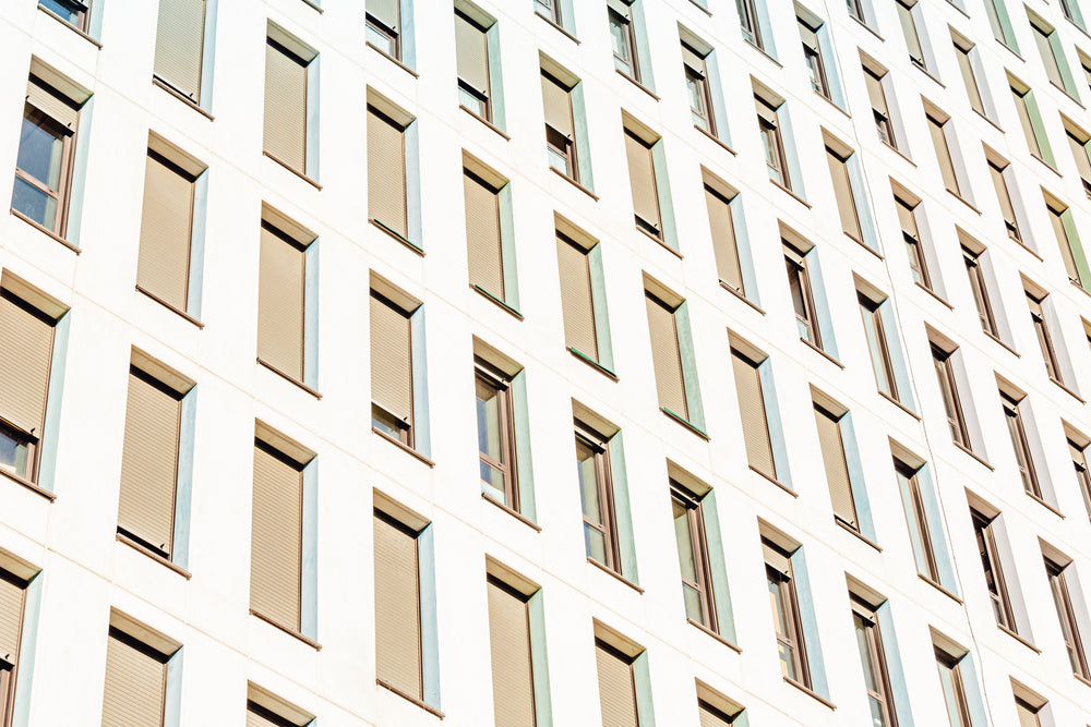 a white building with beige windows