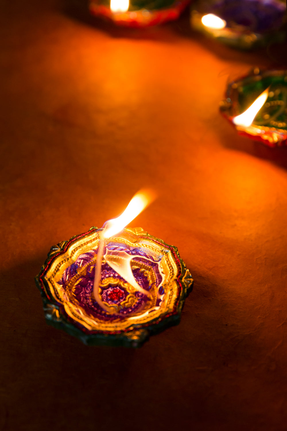 a wick oil candle burns in the dark