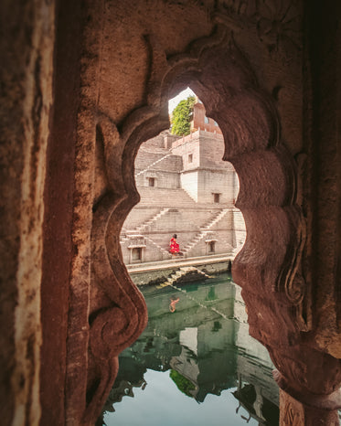 a woman by a green pool