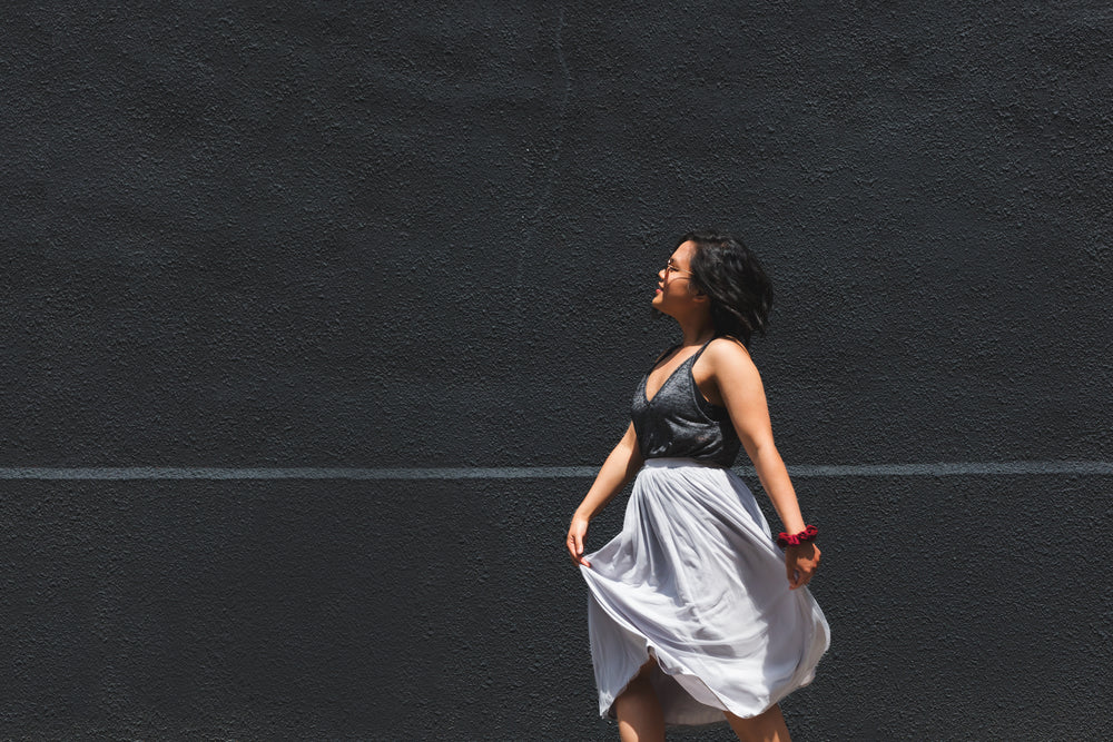 a woman in grey summer clothes