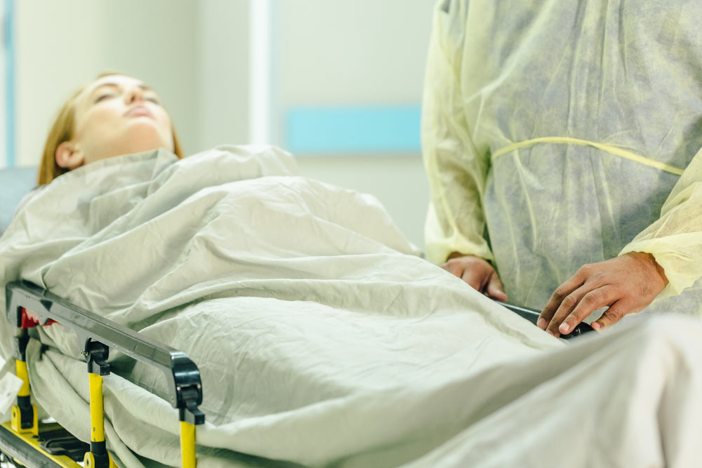 a woman is visited by a doctor in hospital