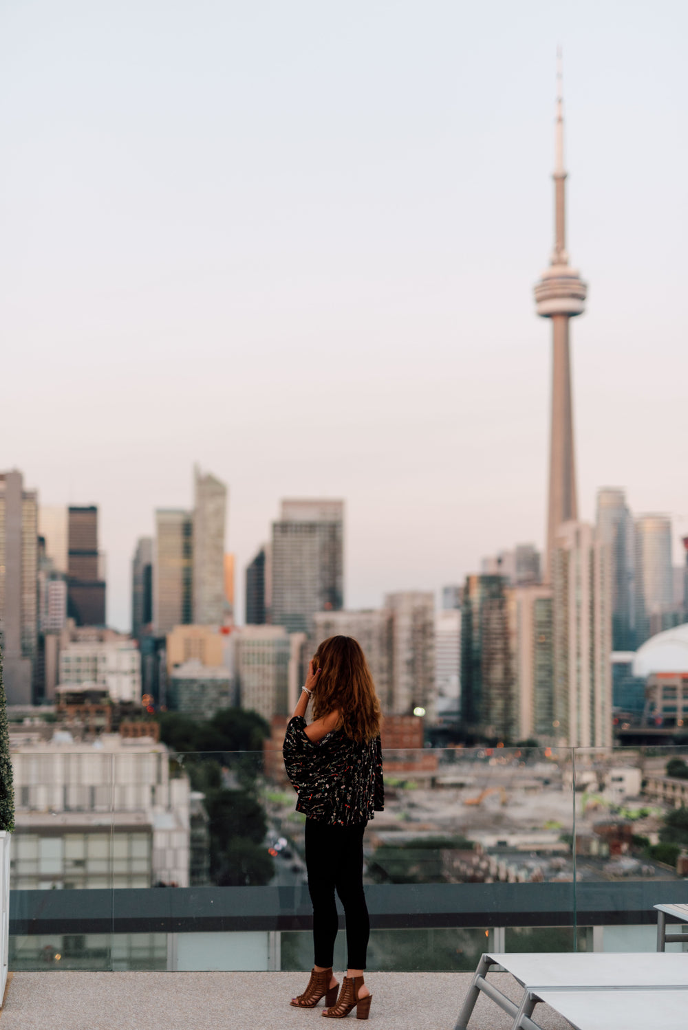 a woman looking out at toronto