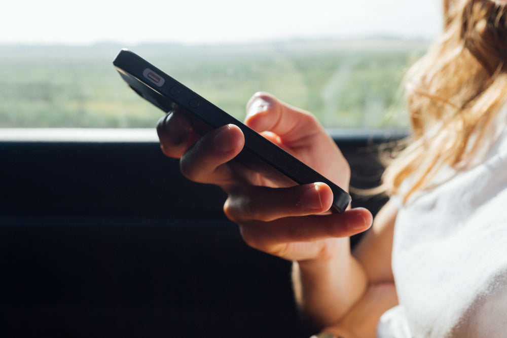 a woman plays on her phone