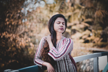 a woman taking in the sound of nature