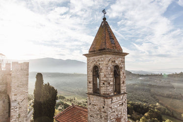 a worn brick bell tower