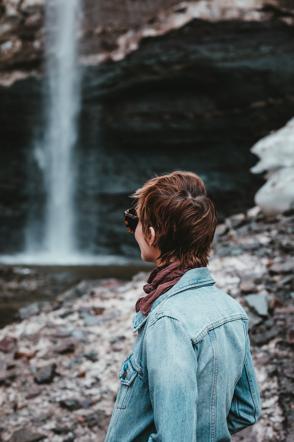 a young woman gazes across the scenery