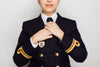 a young woman looks sharp in her navy uniform
