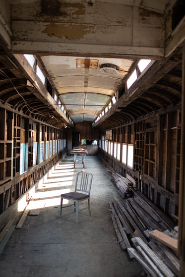 abandoned train car with lone chair