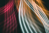abstract image of red white and orange lines curving together