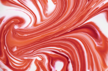 abstract photo of red marbling into white