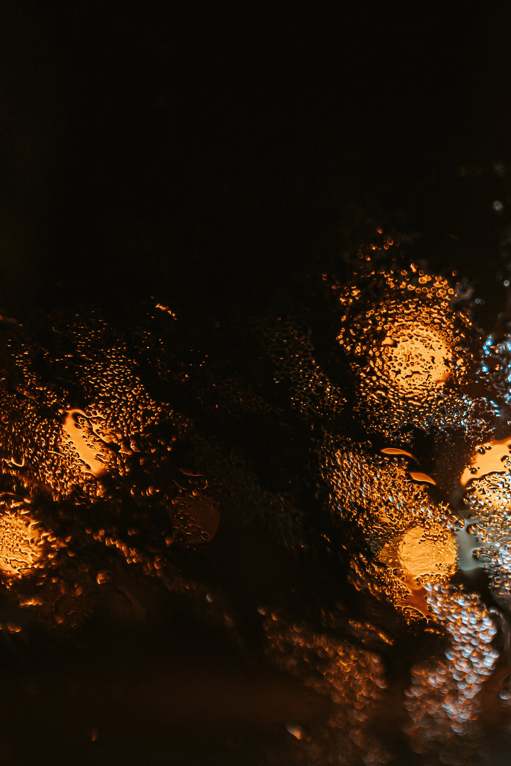 abstract yellow light through wet glass