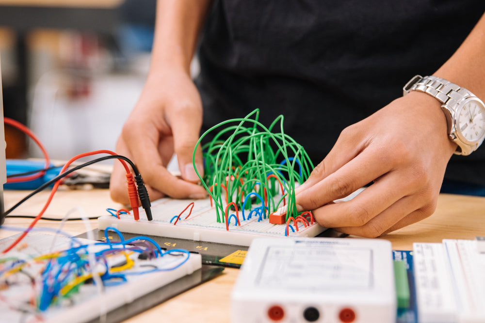 adjusting wires on a circuit board