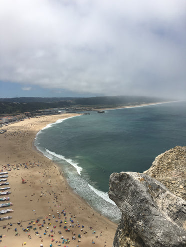 aerial photo of a beach and calm waters